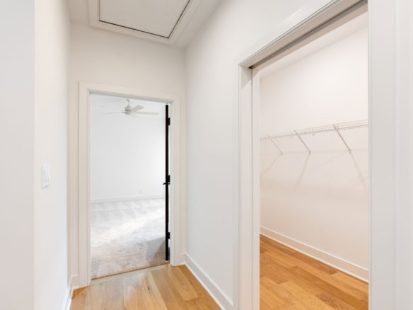 Bright interior view of a closet and adjacent room at 11612 Skypilot Street.