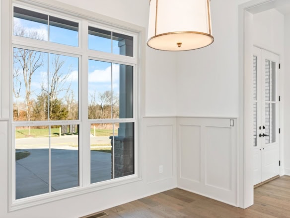 Large window showcasing scenic outdoor view at 3228 Catalpa Farms Drive.