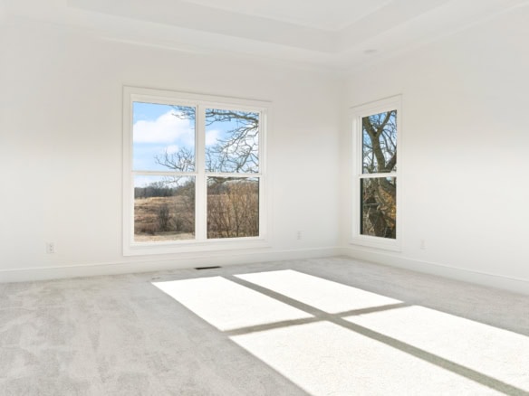 Bright, spacious room with large windows and natural light.
