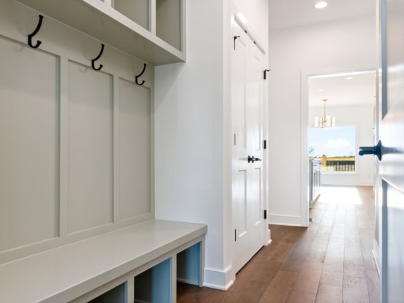 Modern entryway with built-in hooks and storage at 3228 Catalpa Farms Drive.