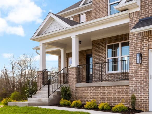 Beautiful brick house with front porch and landscaped yard at 3234 Catalpa Farms Dr.