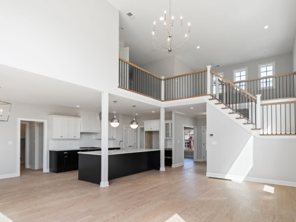 Modern open-concept living area with high ceilings and natural light.