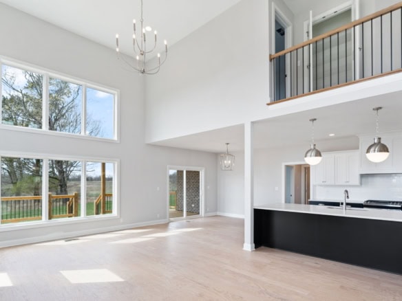 Spacious living area with large windows and high ceilings at 3234 Catalpa Farms Dr. Bright, airy, an.