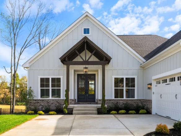 Beautiful new construction home with white siding and black accents at 3235 Catalpa Farms Dr.