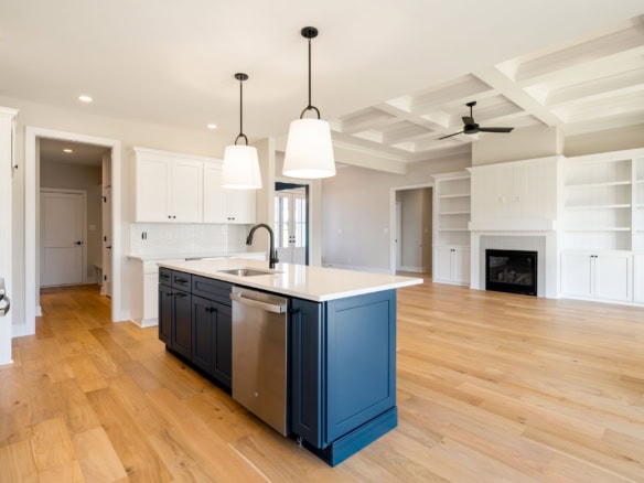 Kitchen with island and open living space at 3235 Catalpa Farms Dr.