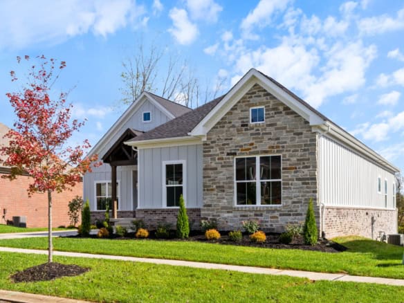 Beautiful new construction home with stone and siding exterior at 3235 Catalpa Farms Dr.