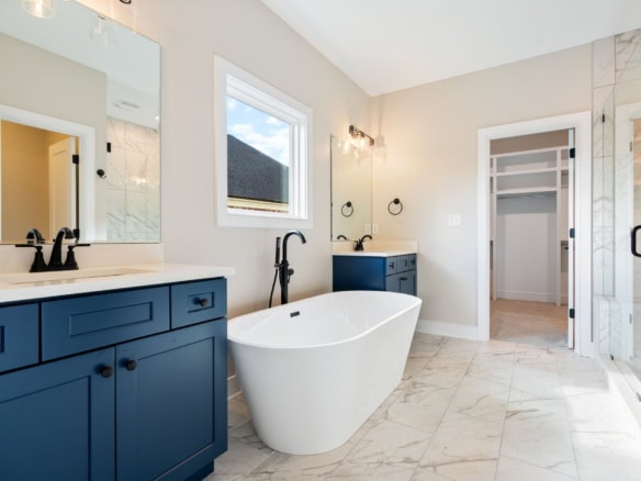 Freestanding bathtub and walk-in shower in a contemporary bathroom at 3235 Catalpa Farms Dr.