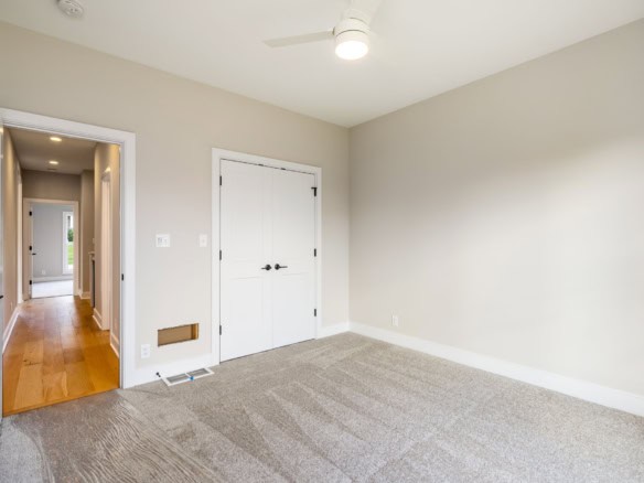 Bright, empty room with neutral walls and carpet flooring at 3235 Catalpa Farms Dr.