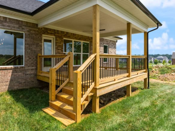 Deck with wooden railing and stairs at 3236 Catalpa Farms Dr.