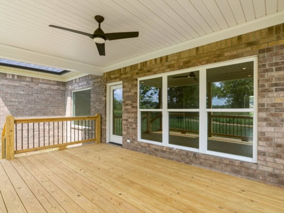 Covered deck with ceiling fan and large windows at 3236 Catalpa Farms Dr.