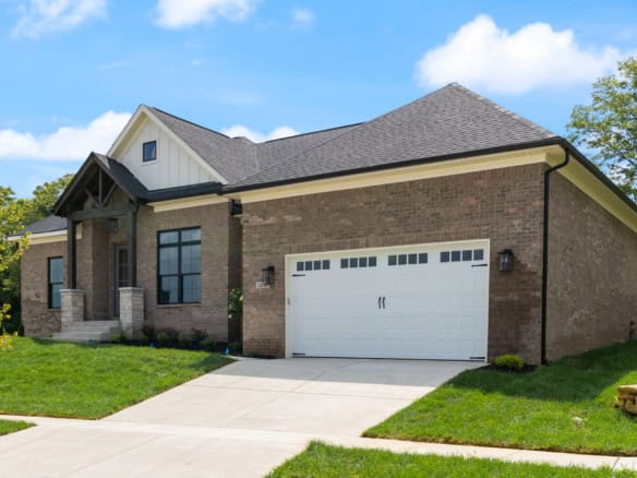 Beautiful new construction home at 3236 Catalpa Farms Dr with brick facade and spacious driveway.