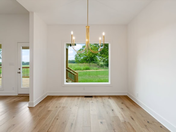 Bright interior featuring a chandelier and scenic outdoor views.