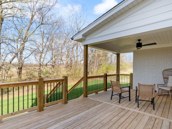 Deck extension with wooden railing at 3320 Catalpa Farms Dr, showcasing quality construction.