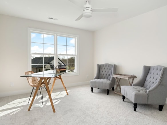 Bright, airy room with large window and minimalist decor.