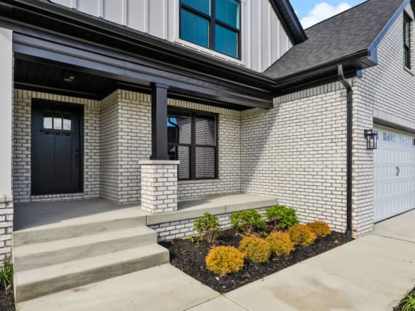 Beautiful brick and siding facade of a contemporary residential house.