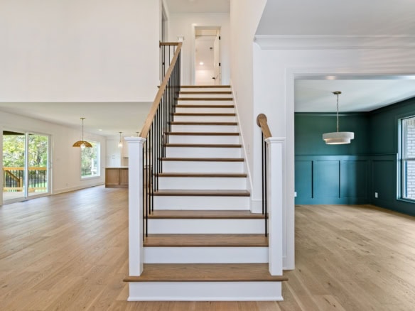 Staircase leading to the upper floor in a newly built home at 3322 Catalpa Farms Dr.
