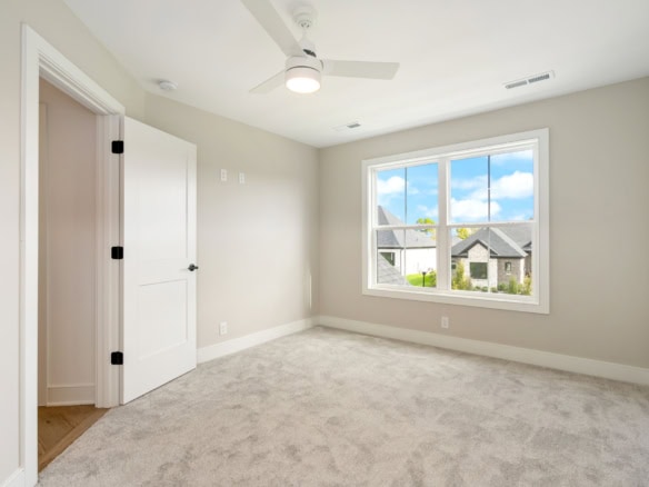 Bedroom with large window and neutral decor at 3322 Catalpa Farms Dr.