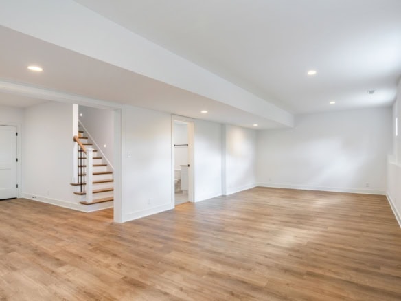 Spacious, bright living area with hardwood flooring and large windows. Perfect for family gatherings.