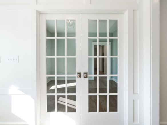 Glass double doors with white framing at 6037 Cherry Lane.