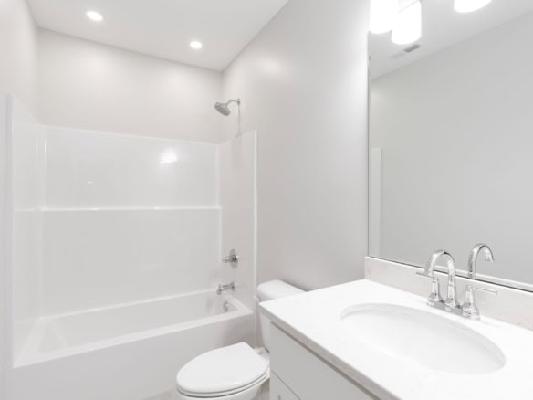 Bathroom with bathtub, shower, and vanity at 6037 Cherry Lane.