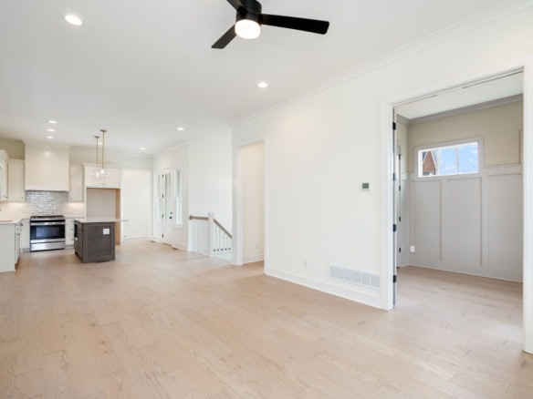 Modern open-concept living space with bright natural light at 6111 Passionflower Dr.
