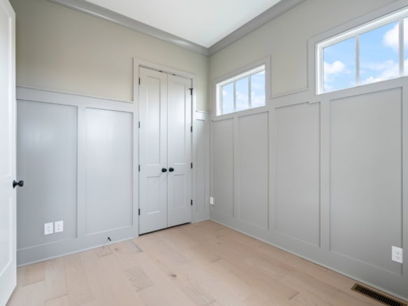 Bright interior with large windows and light-colored walls at 6111 Passionflower Dr.