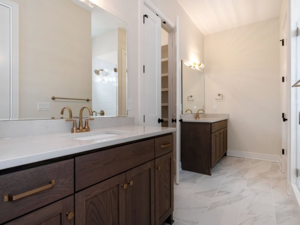 Elegant bathroom vanity with dual sinks and modern fixtures.