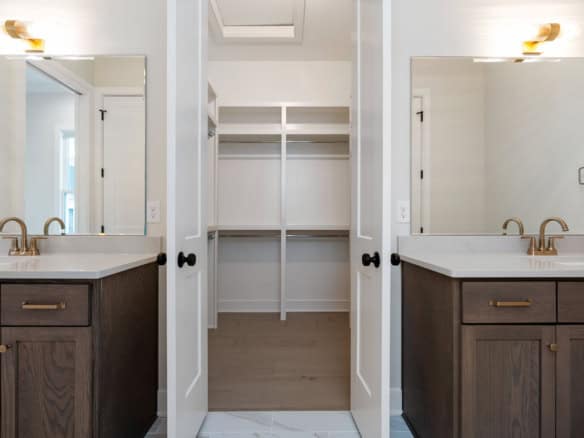 Elegant bathroom with double sinks and ample storage space.