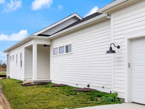 New white house with modern design and clean siding.