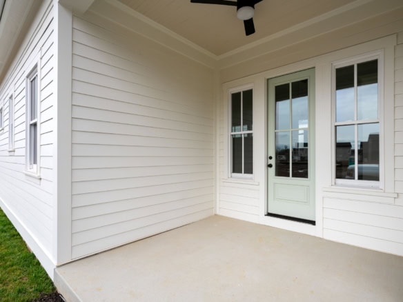 New white siding and porch at 6111 Passionflower Dr.