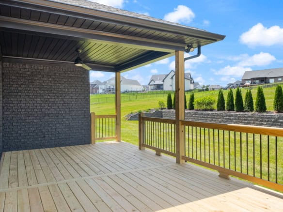 Deck with covered patio at 6207 Brentwood Dr, showcasing quality craftsmanship and outdoor living sp.
