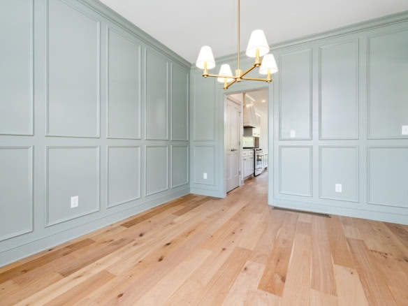 Elegant light blue wainscoting walls in a renovated home interior.