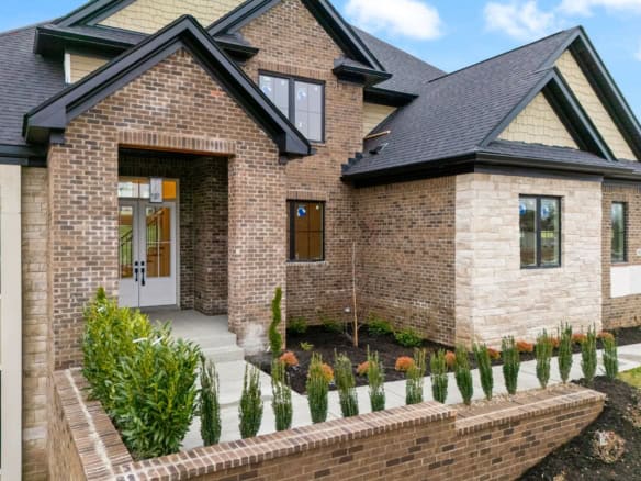 New brick house with landscaped front yard at 6307 Brentwood Dr.