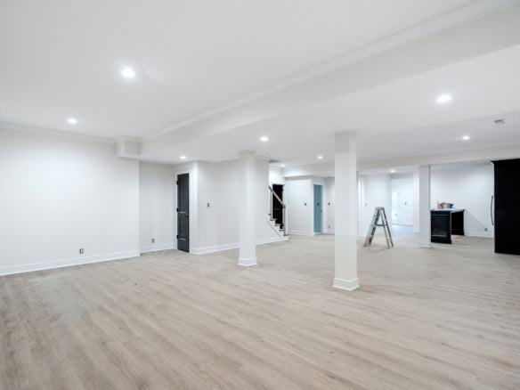 Spacious, modern interior with open floor plan and bright lighting.