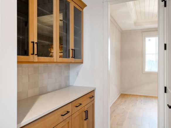Bright kitchen with wooden cabinets and natural light in a residential home.