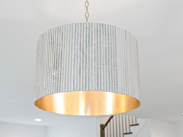 Elegant gold and silver chandelier for stylish home lighting.