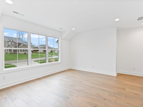 Bright, spacious living room with large windows and natural light.
