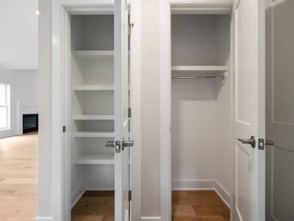 Closet with built-in shelves and hanging rod at 6505 Hypoint Ridge Rd.