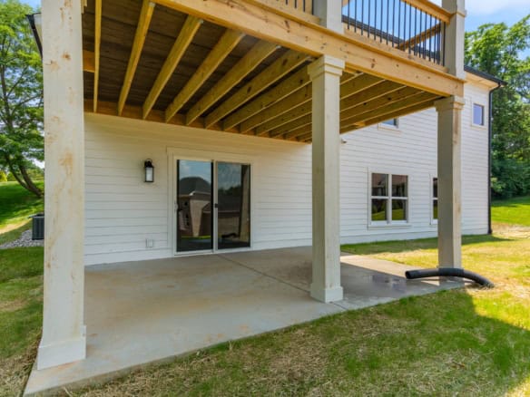 Modern backyard deck with covered patio area at 6603 Oakmont Cir.