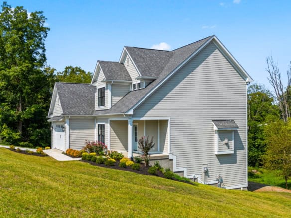 Beautiful new home with modern design and lush landscaping.