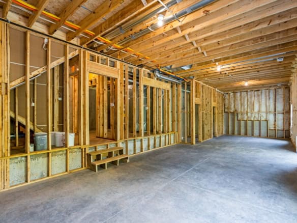 Interior framing of a new residential building under construction.