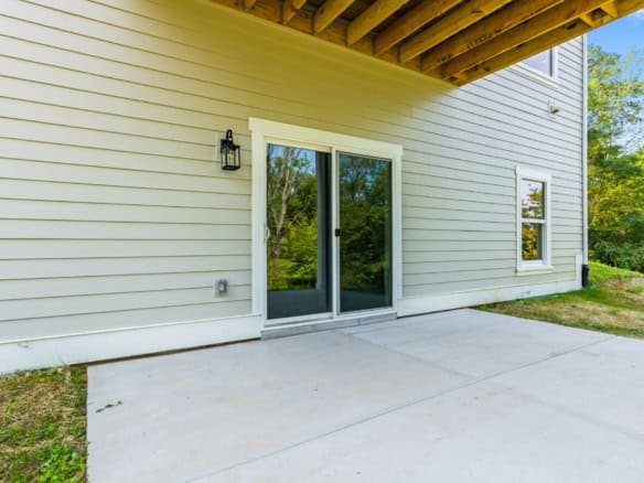Modern sliding glass door with outdoor patio at 6712 Hypoint Ridge Rd.