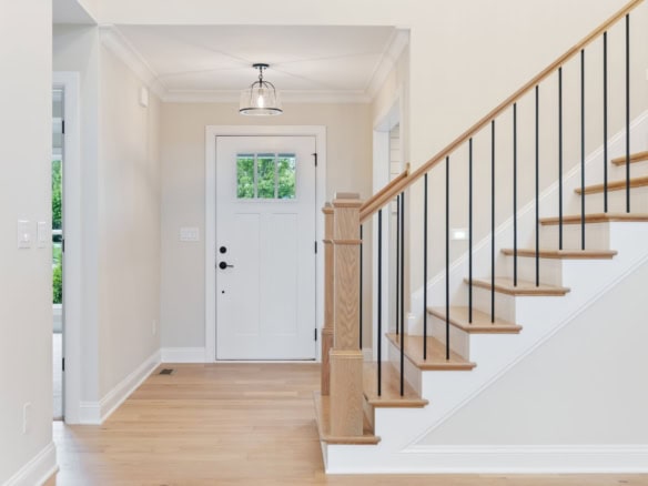 Entryway with staircase at 6713 Hypoint Ridge Rd, modern interior design.