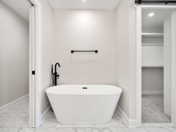 Beautiful bathroom featuring a sleek freestanding bathtub and minimalist design.