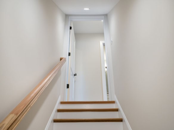 Interior staircase at 6713 Hypoint Ridge Rd.