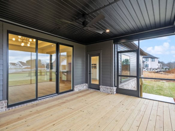 Modern screened porch with sliding glass doors at 7395 Edith Way.