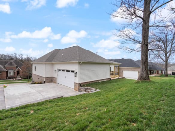 Modern suburban home with spacious driveway and lawn, located at 7517 Beechspring Farm Blvd.